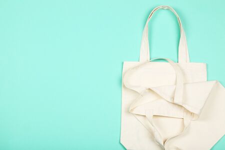 White cotton eco bags on mint background
