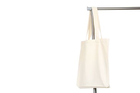 White cotton eco bag hanging on clothes rackの写真素材