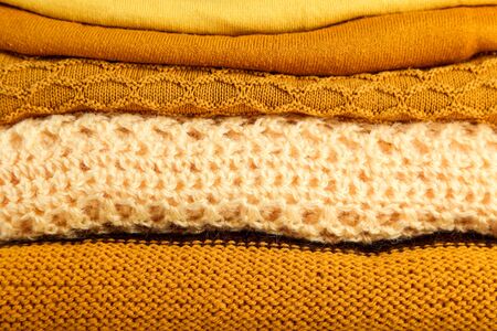 Background of folded colorful sweaters