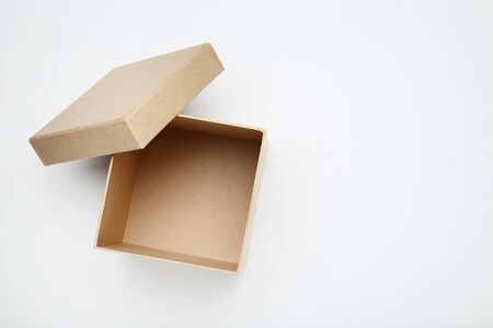 Open brown gift box on white background