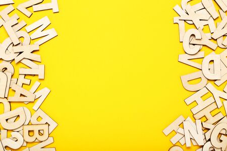 Wooden letters on yellow backgroundの写真素材