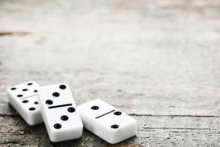 Dominoes on grey wooden table
