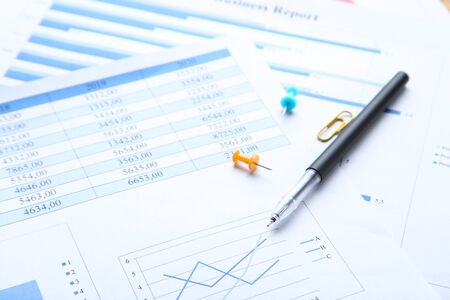 Financial papers with graph and chartsの写真素材