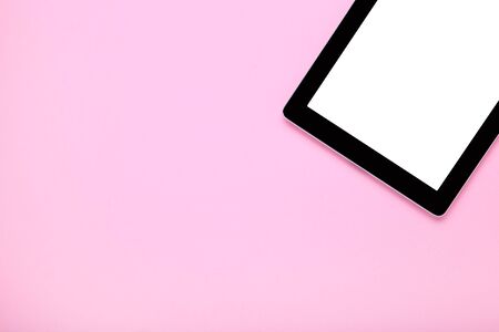 Tablet computer on pink backgroundの写真素材