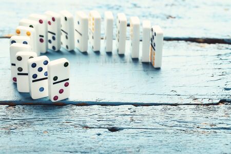 Dominoes on blue wooden table