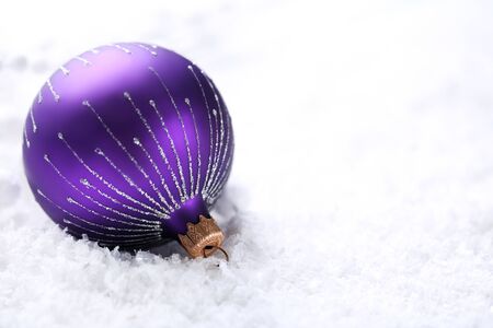 Christmas bauble on white snowの写真素材