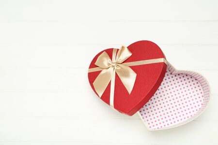 Gift box in shape of heart on white backgroundの写真素材