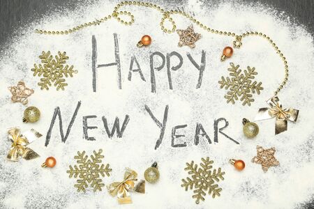 Text Happy New Year on flour with ornamentsの写真素材