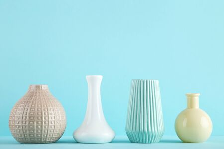Different ceramic vases on blue backgroundの写真素材