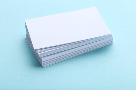 Blank business cards on blue background