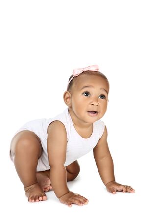 American baby girl sitting on white backgroundの写真素材