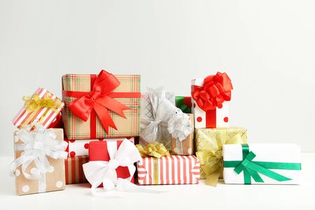 Gift boxes with ribbons on white backgroundの写真素材