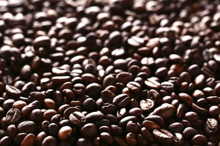 Background of brown coffee beansの写真素材