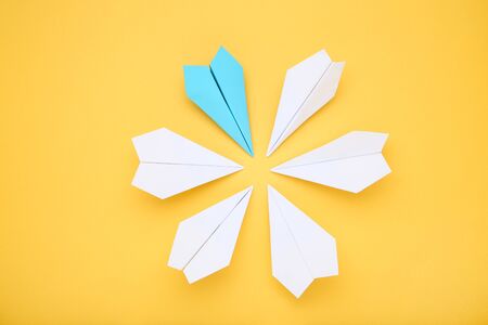 Paper plane leader on yellow background