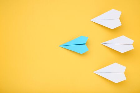 Paper plane leader on yellow background