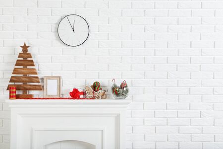 Decorated fireplace for christmas near brick wall at homeの写真素材