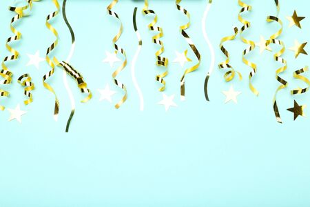 Golden ribbons with stars on blue background