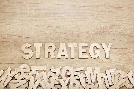 Word Strategy by wooden letters on brown tableの写真素材