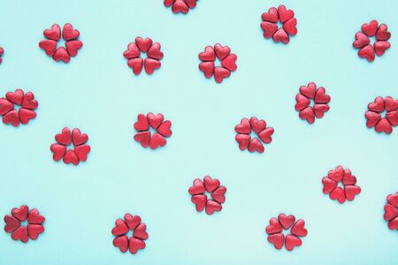 Heart shaped sprinkles on blue backgroundの写真素材