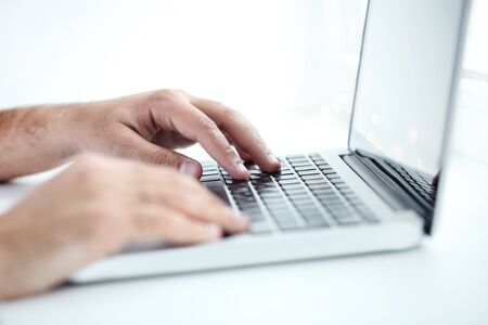 Man working on laptop computer in the office