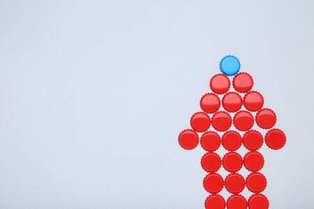 Bottle caps leader on grey backgroundの写真素材