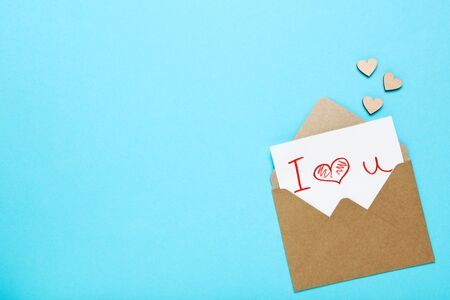 Paper envelope with hearts and text I Love You on blue background
