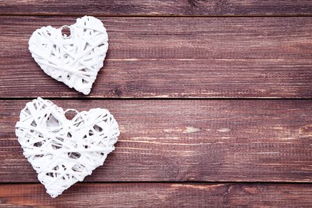 Valentine white hearts on brown wooden tableの写真素材