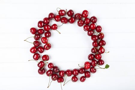 Sweet cherries on white wooden tableの写真素材