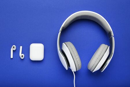 Three different earphones on blue backgroundの写真素材