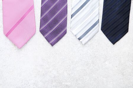 Colorful neckties on grey background