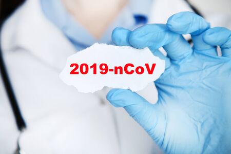 Doctor holding paper with text 2019-nCovの写真素材