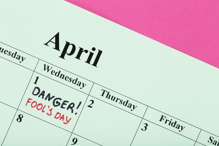 Text Danger Fool's Day on paper calendar