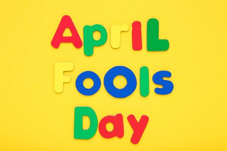 Text April Fool's Day on yellow backgroundの写真素材