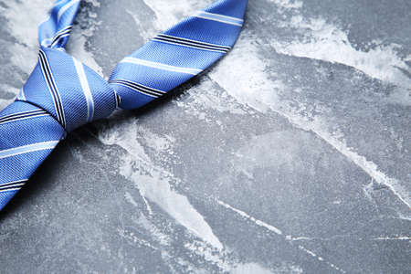 Blue necktie on gray backgroundの写真素材