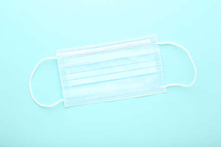 Medicine face mask on blue background