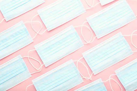 Medicine face masks on pink backgroundの写真素材