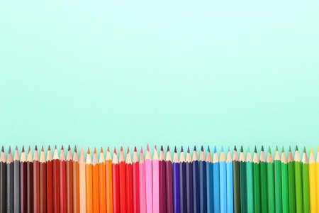 Colored pencils on mint backgroundの写真素材
