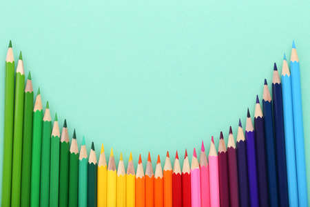 Colored pencils on mint backgroundの写真素材