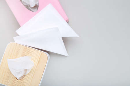 Paper napkin boxes on gray backgroundの写真素材