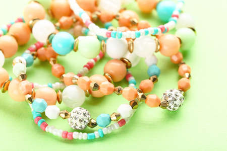 Beautiful bracelets on green background
