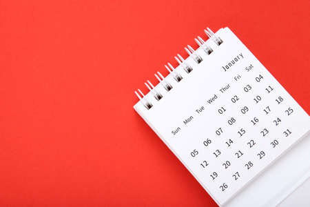 Paper calendar page on red backgroundの写真素材