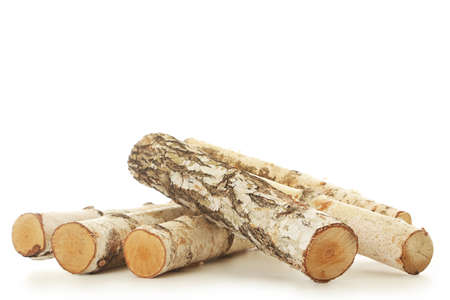 Pile of dry firewood isolated on white backgroundの写真素材