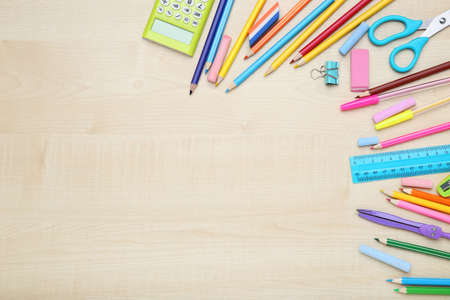 Different school supplies on brown wooden tableの写真素材