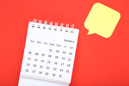 Calendar page with speech bubble on red backgroundの写真素材