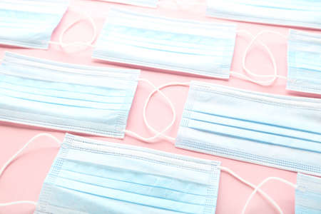 Medicine face masks on pink backgroundの写真素材