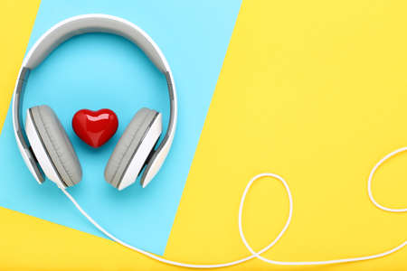 Headphones and red heart on colorful backgroundの写真素材