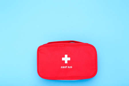 First aid kit on blue background