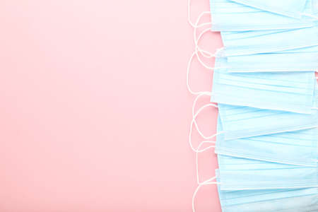 Medicine face masks on pink backgroundの写真素材