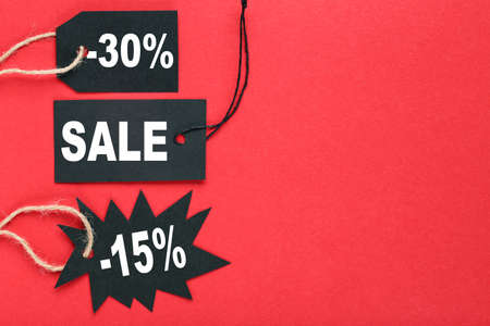 Sale tags with text Sale, 15 and 30 percents on red backgroundの写真素材