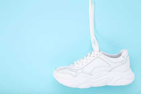 White shoe on blue backgroundの写真素材
